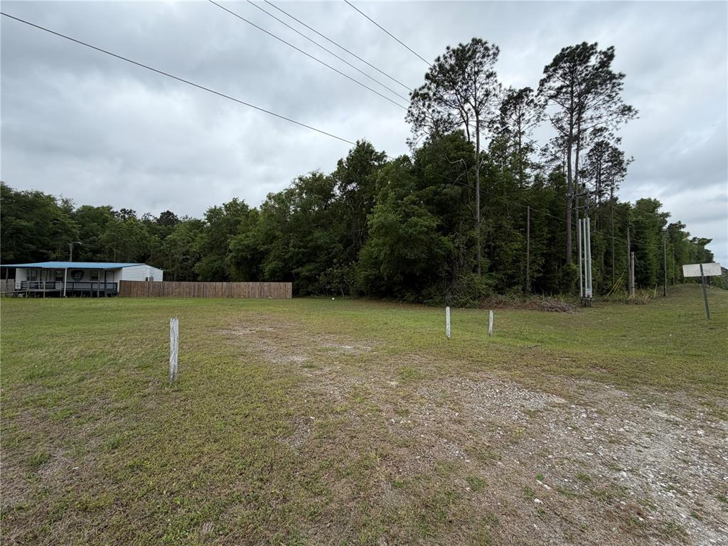683 North Court Street Bronson, FL 32621 - Photo 28 of 33 a backyard of a house with lots of green space