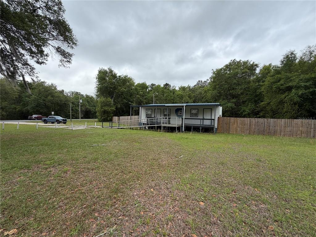 683 North Court Street Bronson, FL 32621 - Photo 32 of 33 a view of a house with a backyard