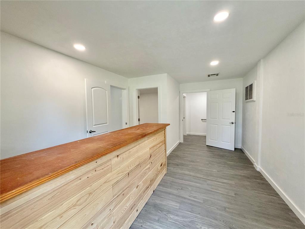 683 North Court Street Bronson, FL 32621 - Photo 5 of 33 a view of an empty room and wooden floor