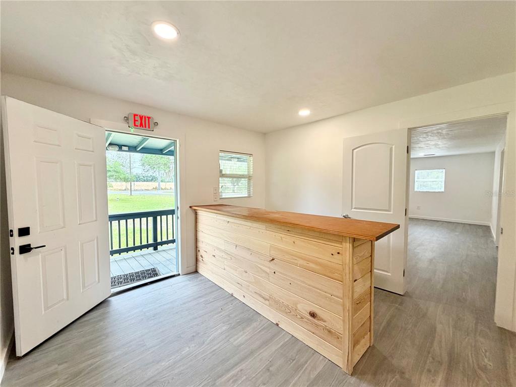 683 North Court Street Bronson, FL 32621 - Photo 6 of 33 wooden floor with white walls and window