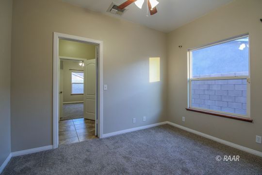 428 Abigail Street Ridgecrest, CA 93555 - Photo 20 of 34 an empty room with windows and closet