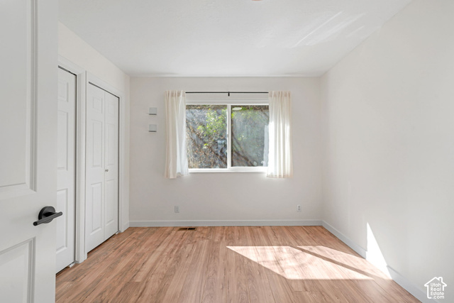 380 Luzern Road Midway, UT 84049 - Photo 11 of 41 Wood-finish flooring, white walls, and a window with natural light