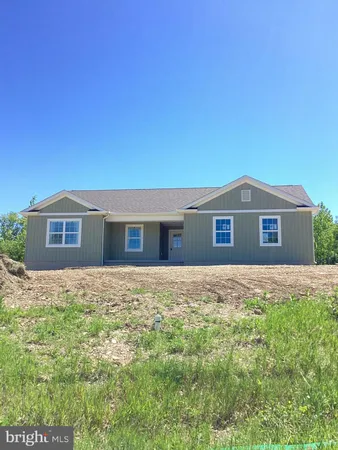 a front view of a house with yard