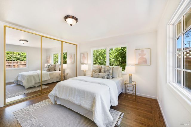 a bedroom with a bed and a couch