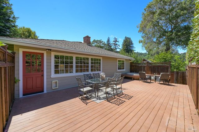 a view of a house with sitting area and wooden flooring