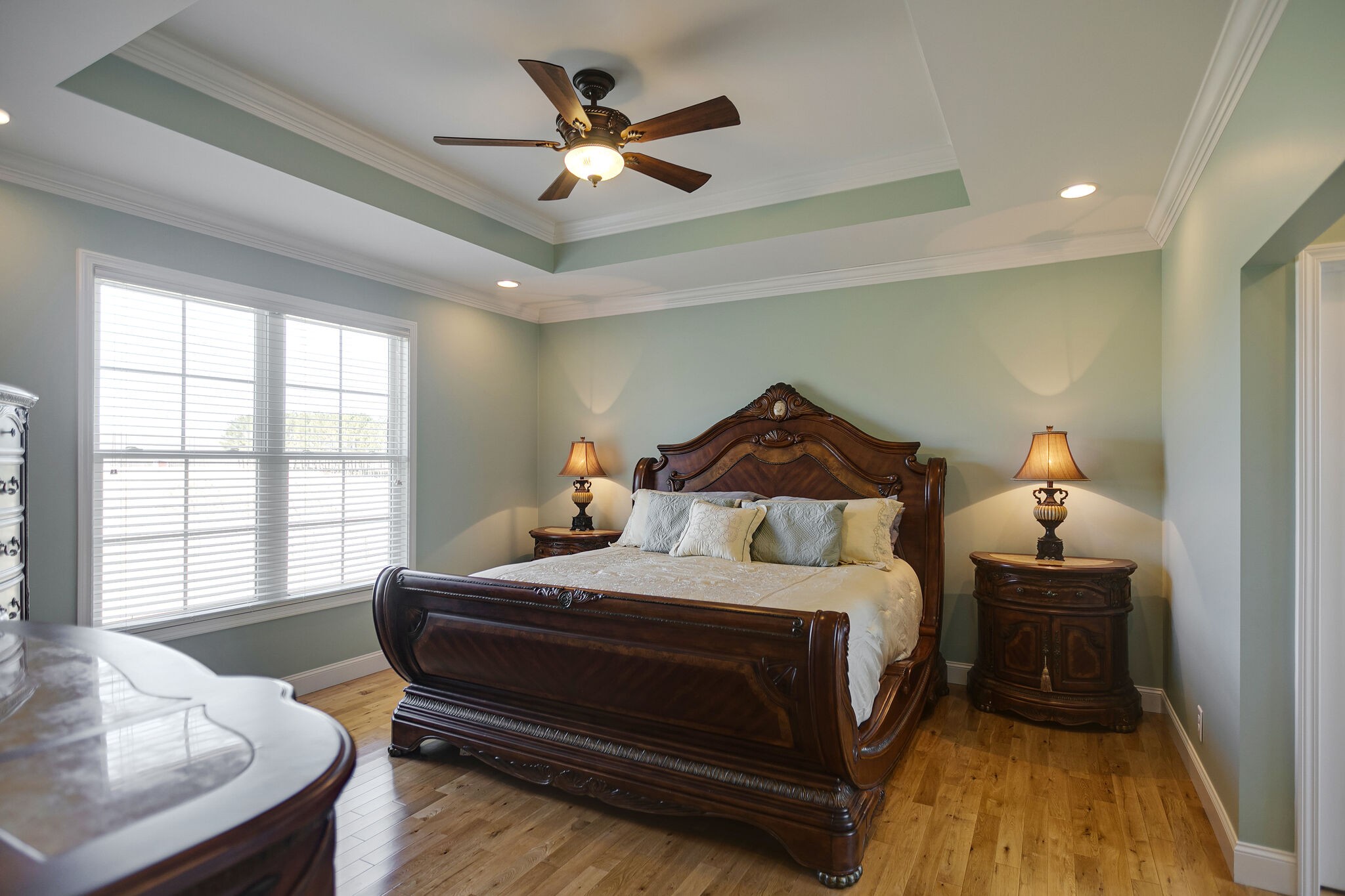 58 Locker Road Summertown, TN 38483 - Photo 12 of 28 a bedroom with a bed and a chandelier