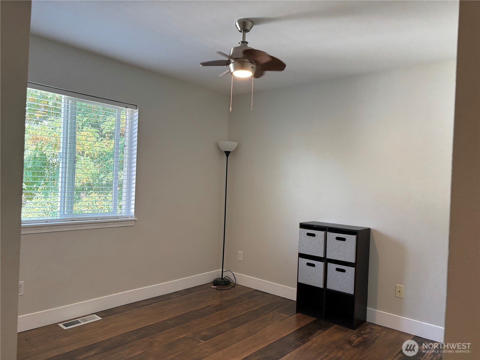 6401 Brycen Lane Southwest, Unit B Olympia, WA 98512 - Photo 15 of 20 a view of a room with wooden floor staircase and a ceiling fan