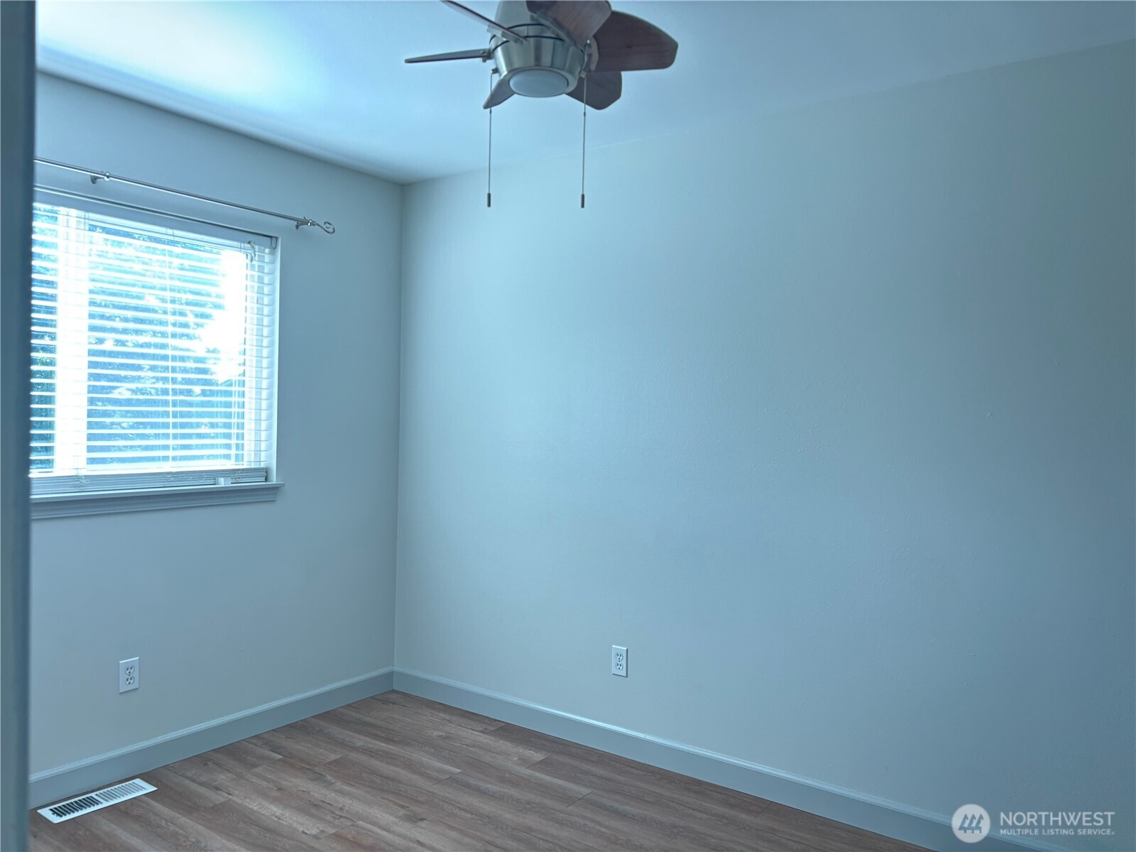 6401 Brycen Lane Southwest, Unit B Olympia, WA 98512 - Photo 16 of 20 a view of a room with a hardwood and a window