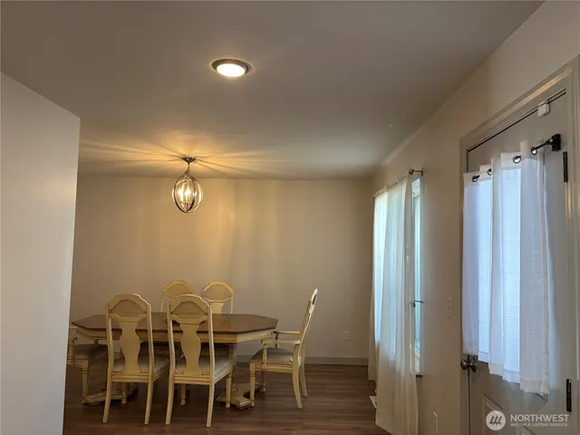 a view of a dining room with furniture