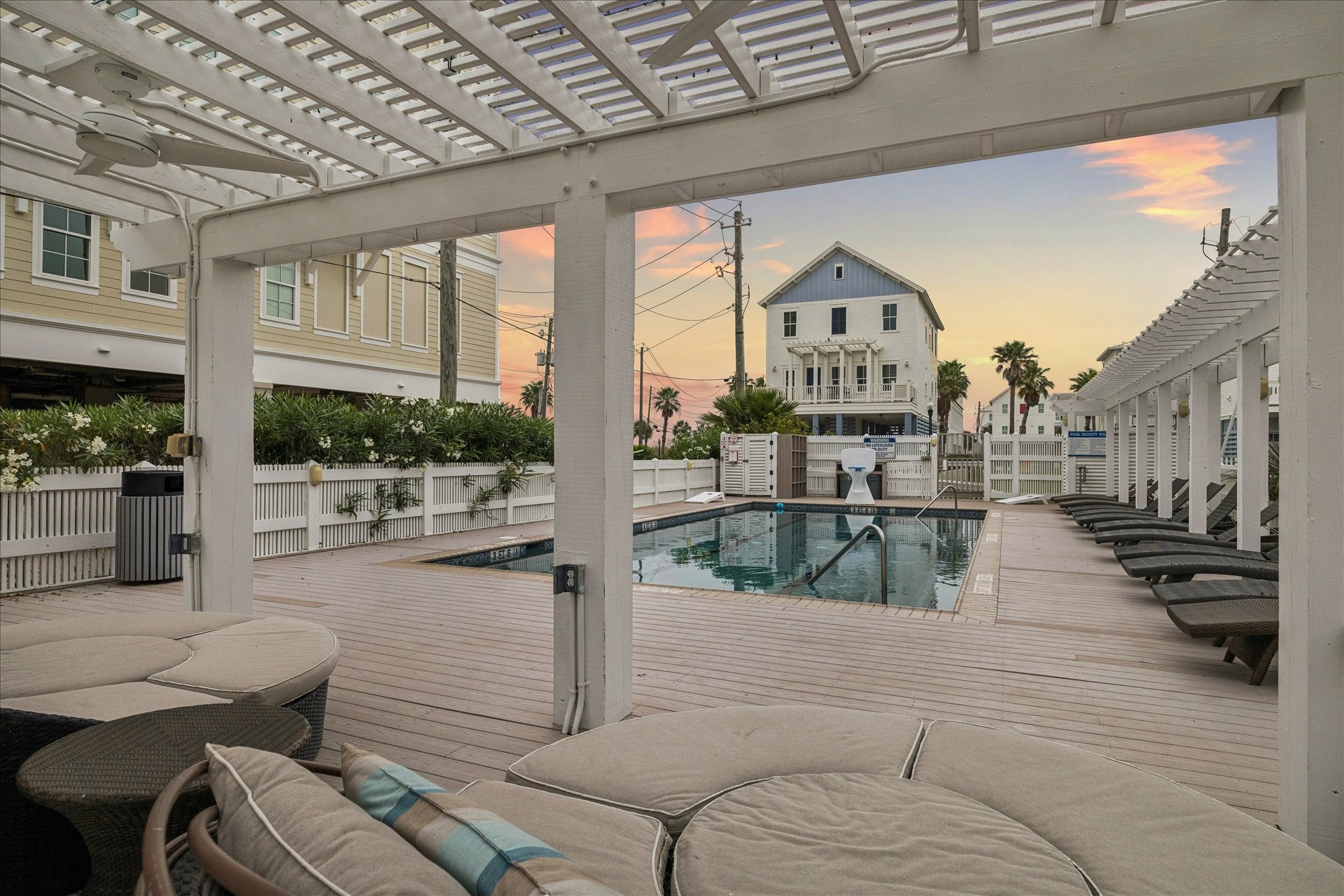 710 Positano Road Galveston, TX 77550 - Photo 28 of 36 Enjoy taking a dip in the neighborhood pool!