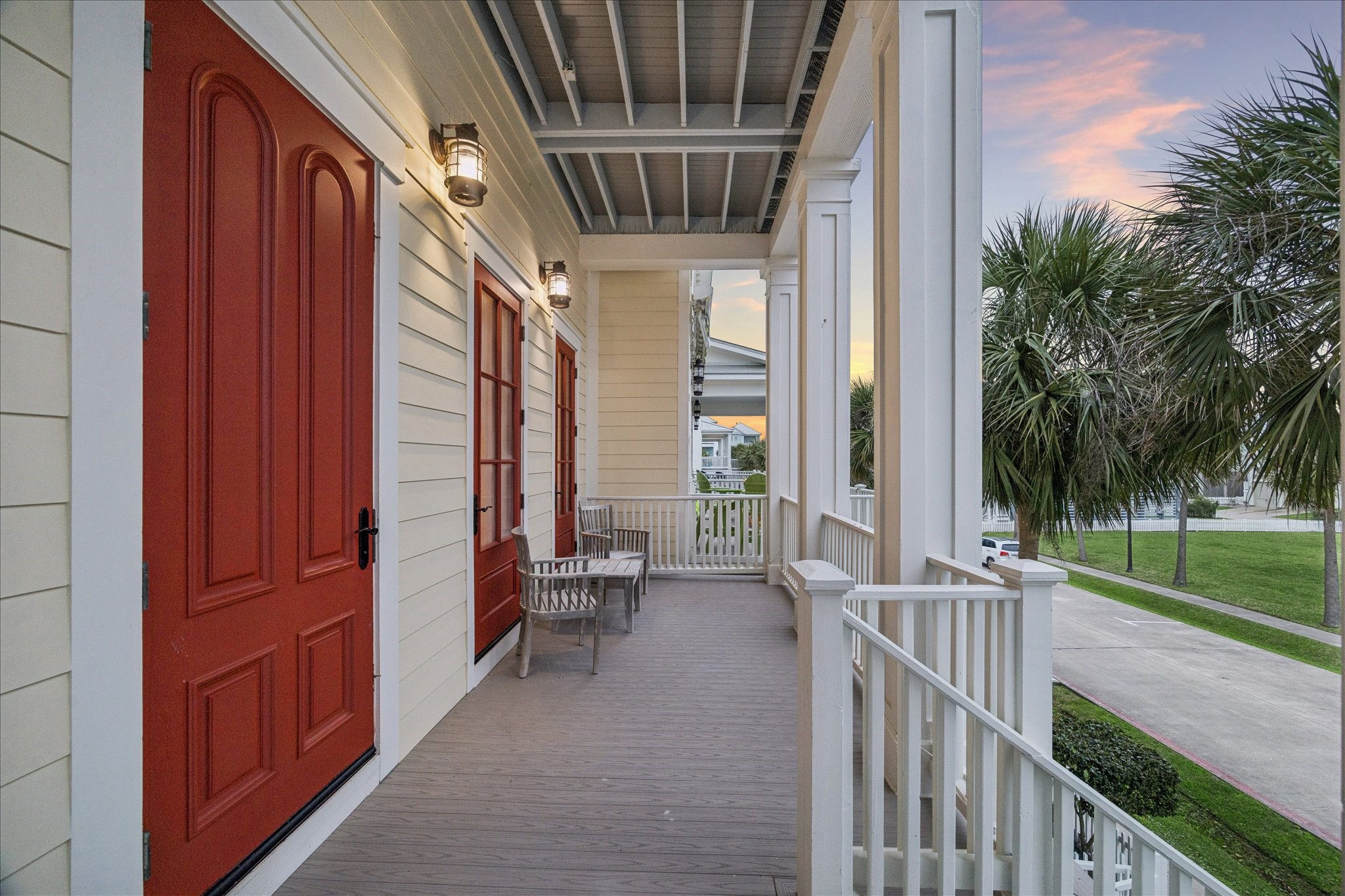710 Positano Road Galveston, TX 77550 - Photo 8 of 36 The charming front porch has views of the gulf and ample seating space.