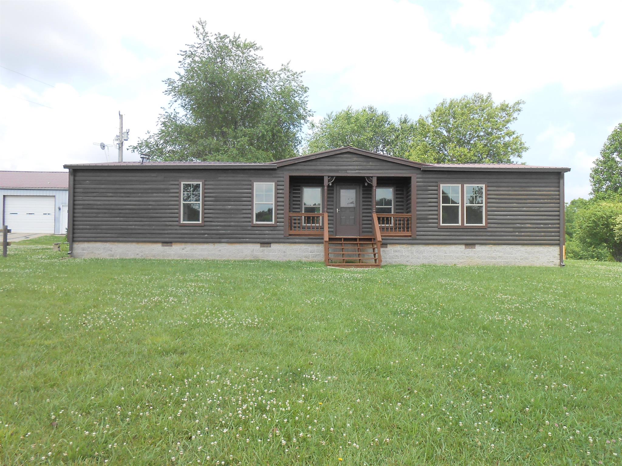 283 Freeland Road Portland, TN 37148 - Photo 2 of 21 a front view of house with yard and green space