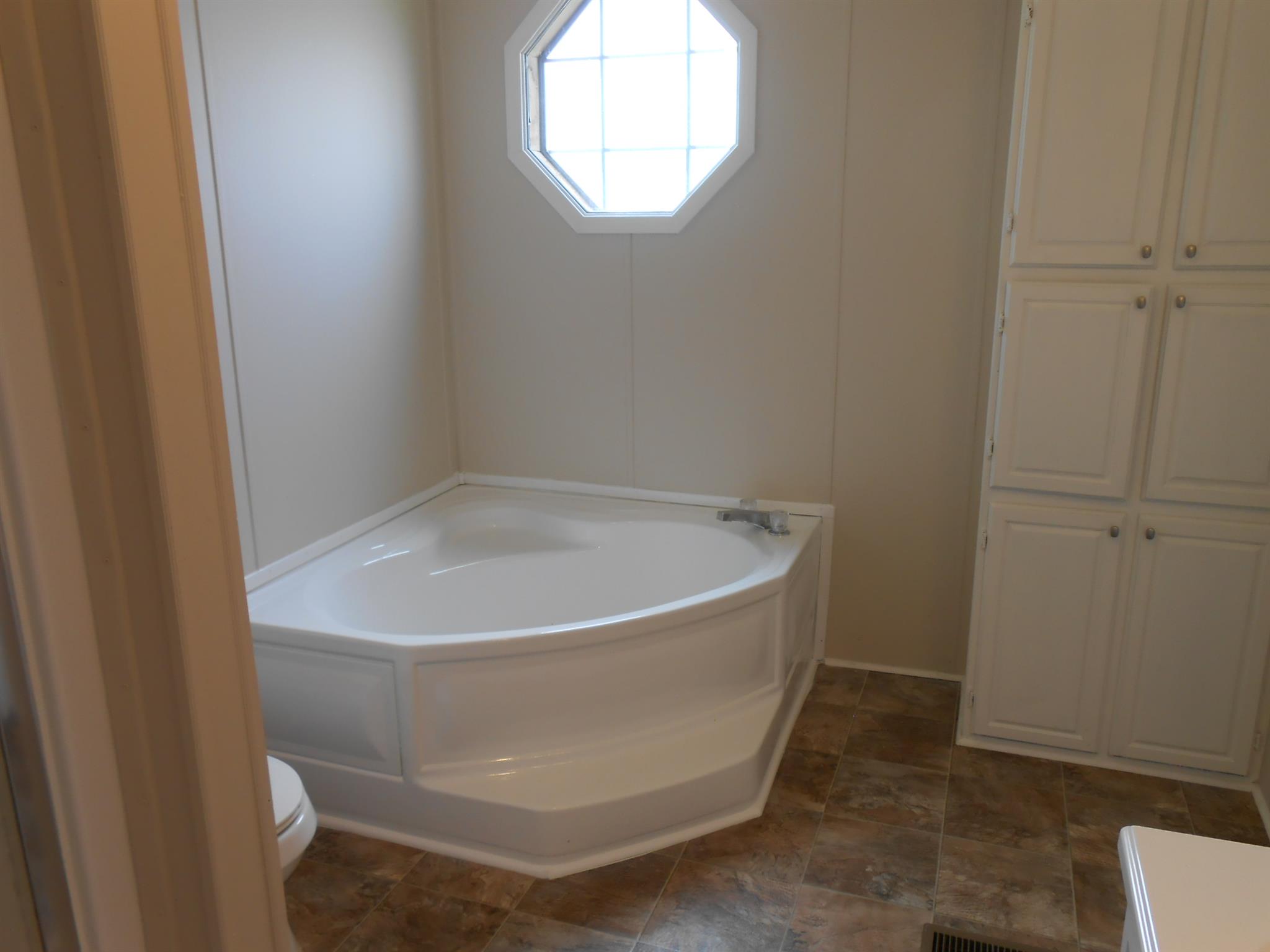 283 Freeland Road Portland, TN 37148 - Photo 13 of 21 a white bath tub sitting in a bathroom