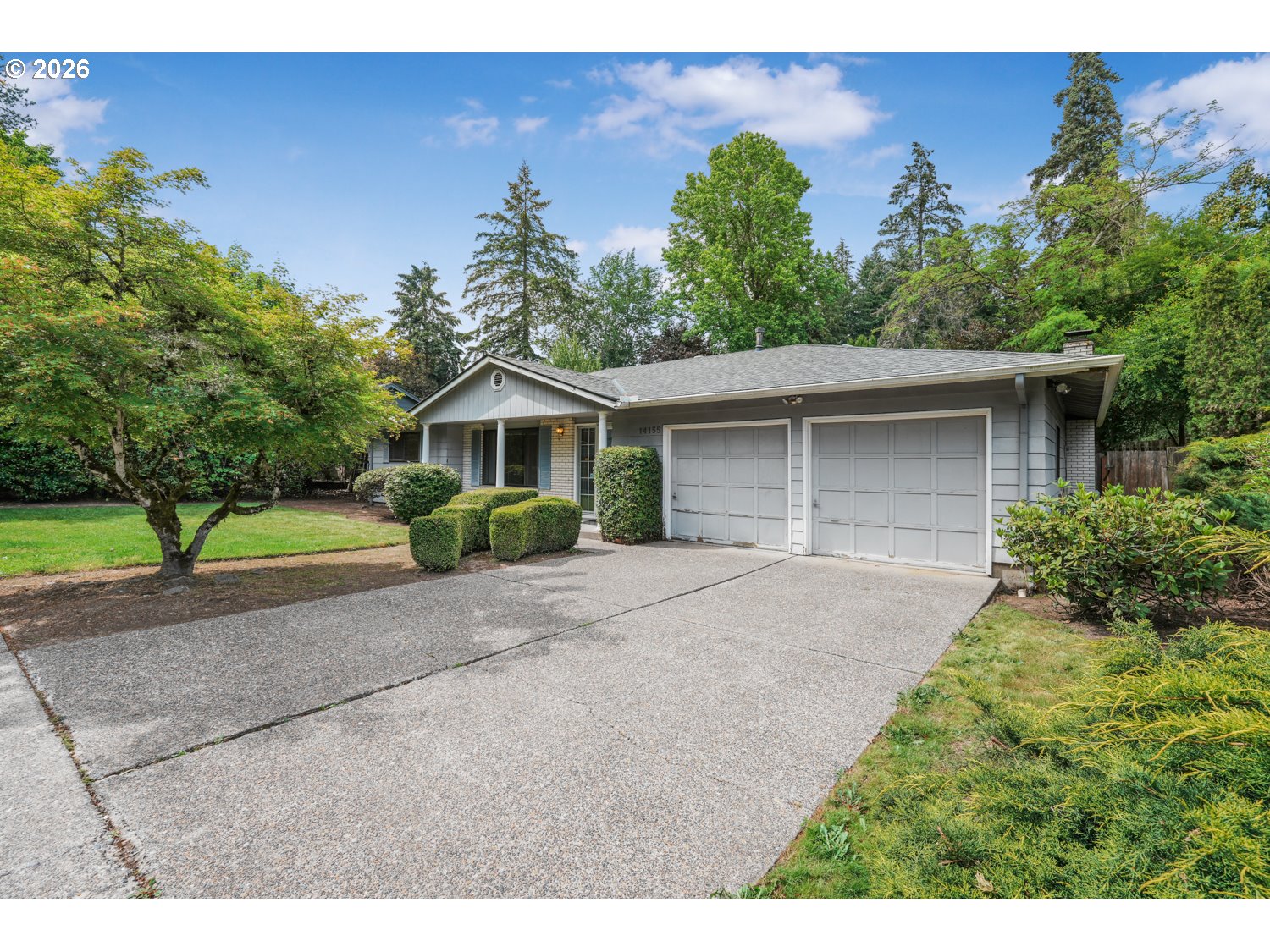 14155 Southwest 27th Street Beaverton, OR 97008 - Photo 2 of 27 a front view of a house with a yard and garage