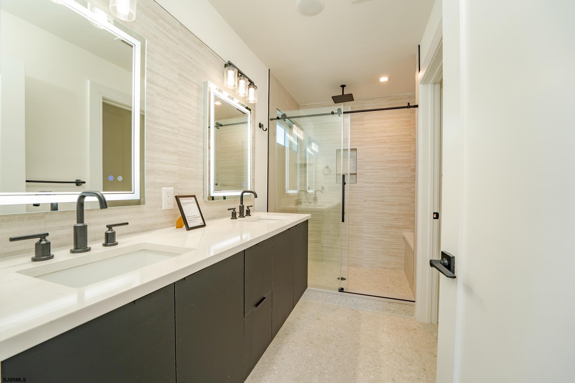 27 Spruce Road Ocean City, NJ 08226 - Photo 41 of 92 a bathroom with a double vanity sink mirror double and shower