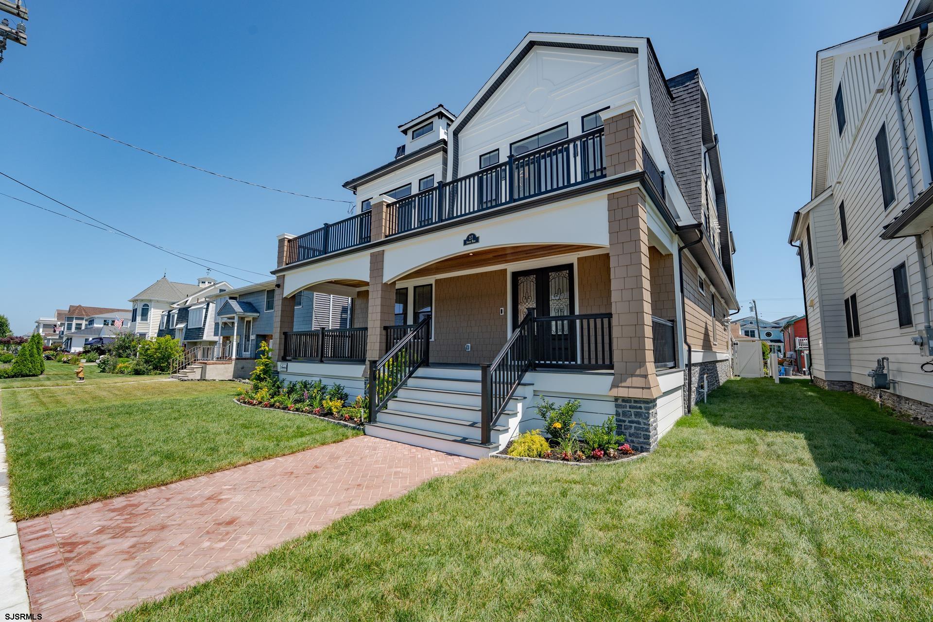27 Spruce Road Ocean City, NJ 08226 - Photo 5 of 92 a front view of a house with a yard
