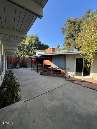 a view of a back yard of the house