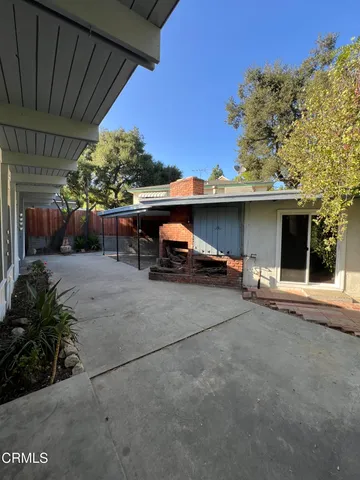 a view of a back yard of the house