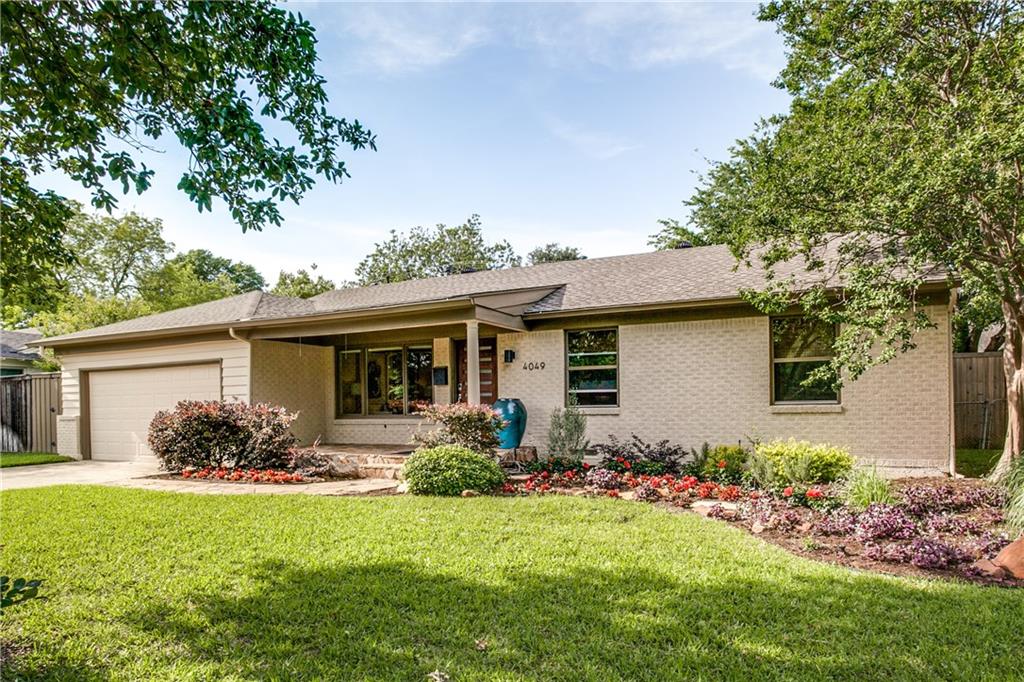 a front view of house with yard and outdoor seating