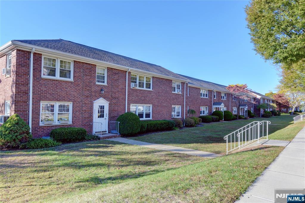 255 Bogert Road, Unit 2A River Edge, NJ 07661 - Photo 25 of 25 a front view of a house with a yard