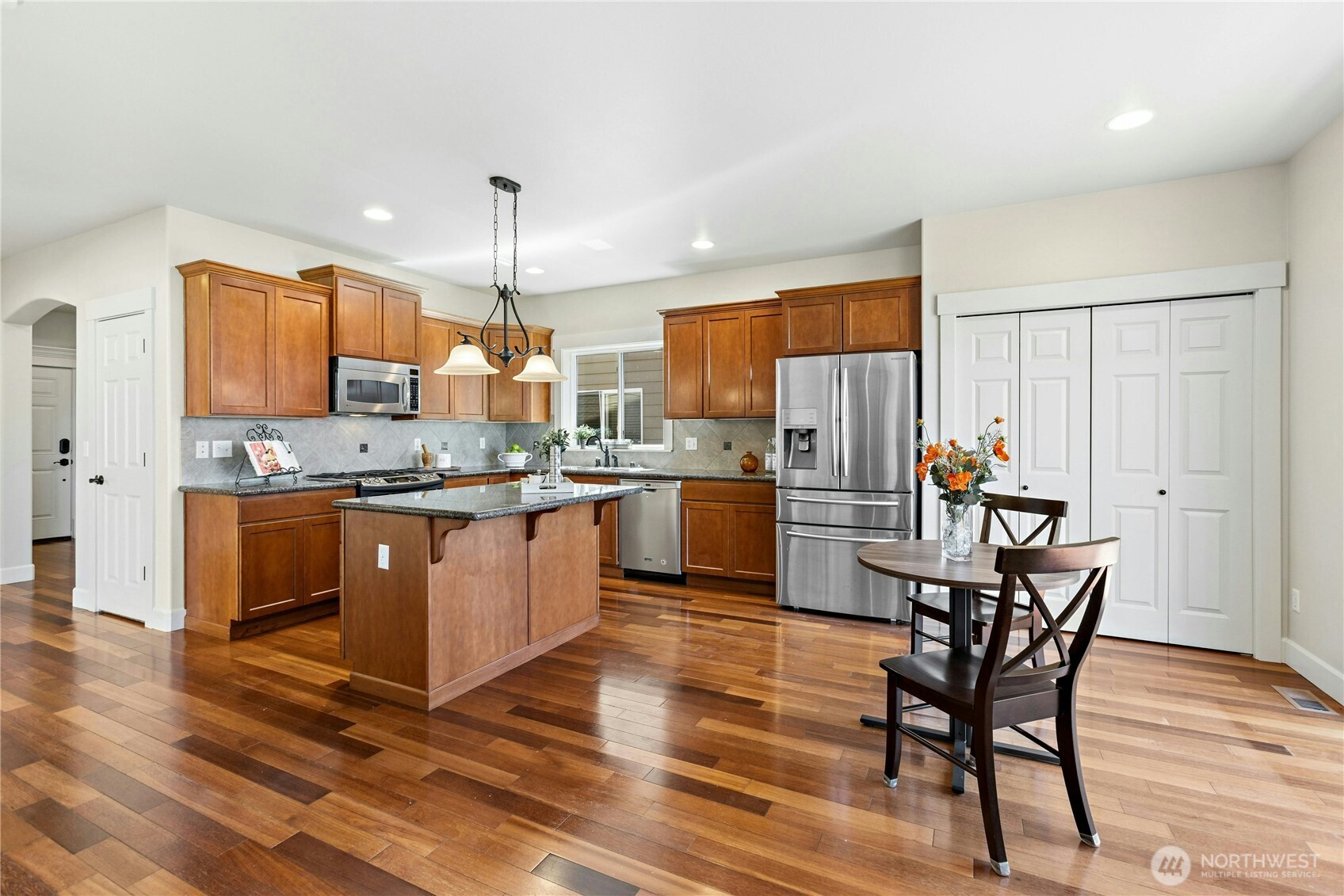 22624 43rd Drive Southeast Bothell, WA 98021 - Photo 10 of 36 a kitchen with stainless steel appliances granite countertop a stove refrigerator and a sink