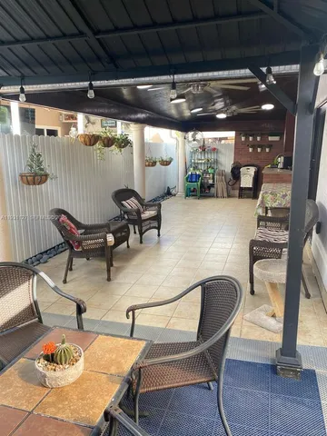 a room with wooden floor and windows