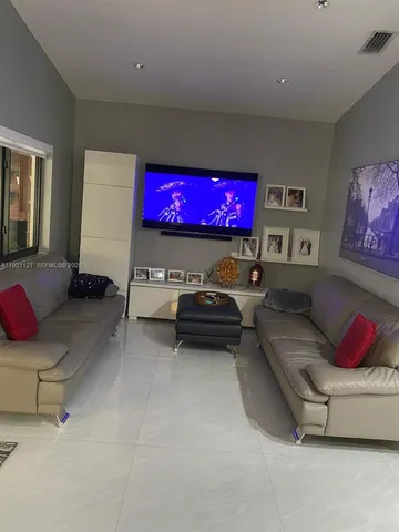 a living room with furniture and a couch