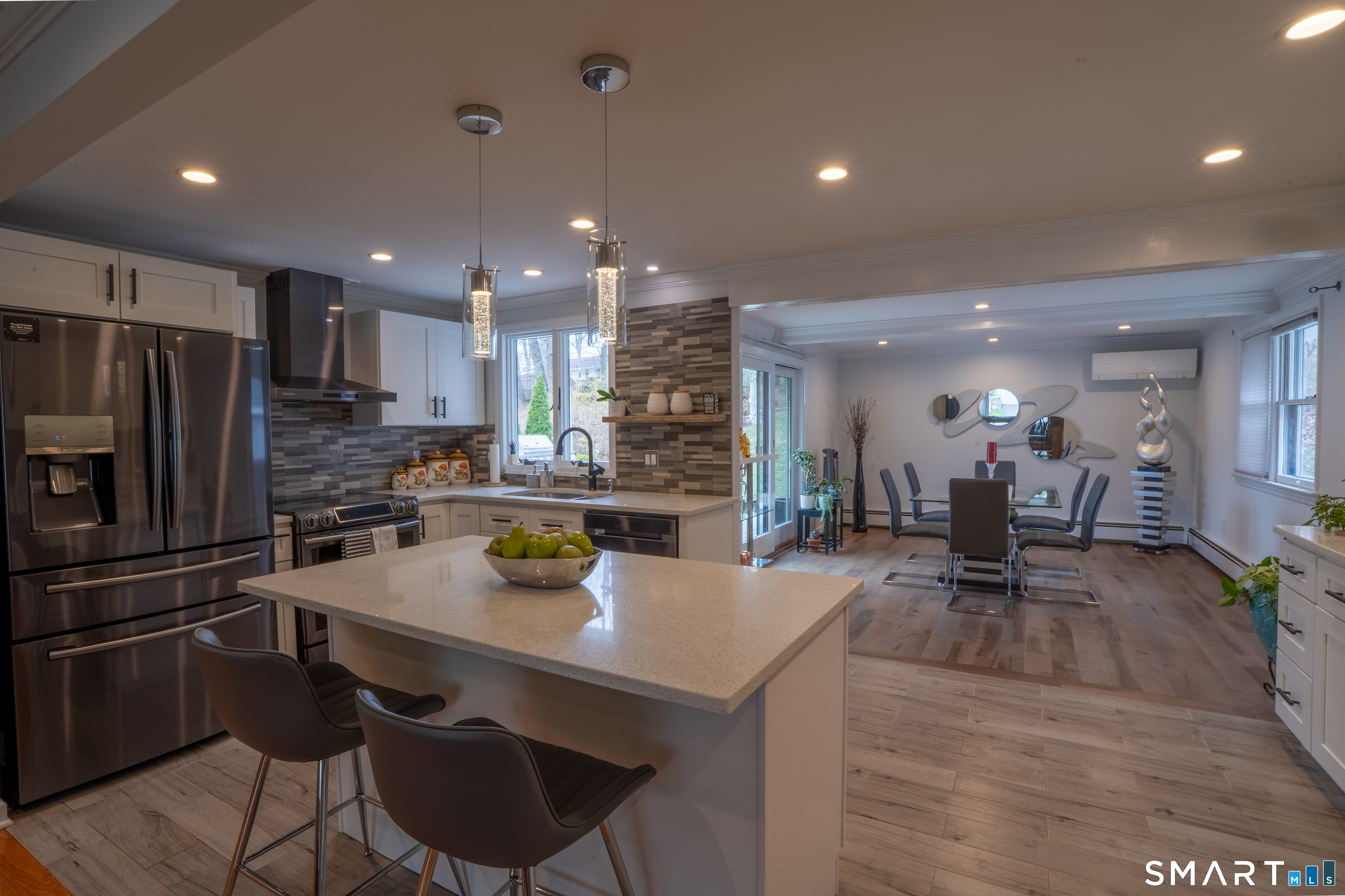 9 Cobblers Lane Norwalk, CT 06851 - Photo 11 of 29 a kitchen with a table chairs refrigerator and microwave