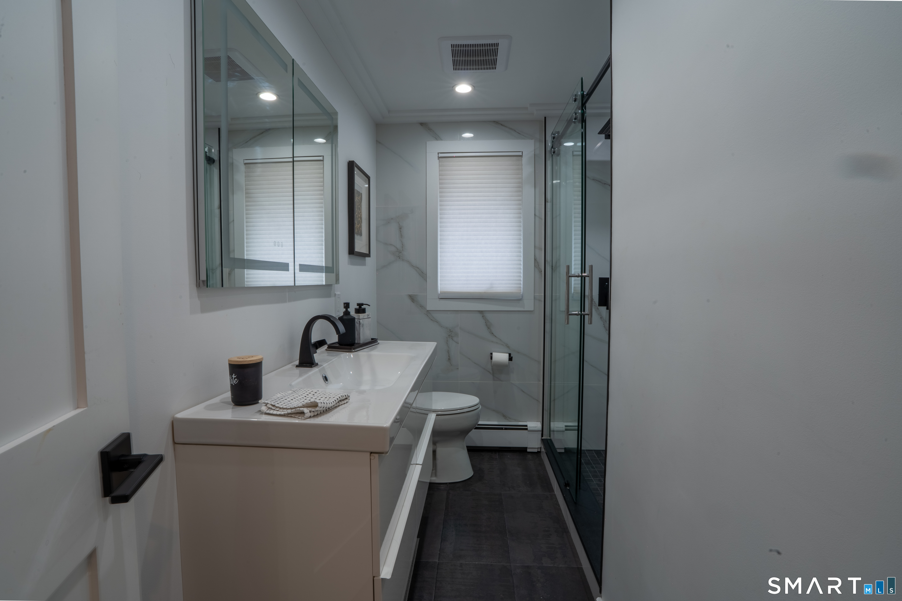 9 Cobblers Lane Norwalk, CT 06851 - Photo 17 of 29 a bathroom with a sink toilet and mirror