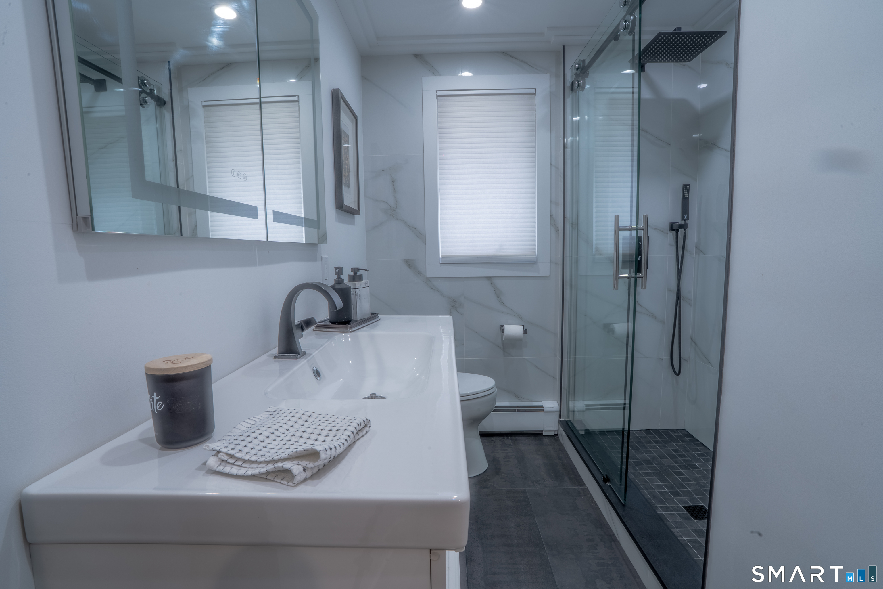 9 Cobblers Lane Norwalk, CT 06851 - Photo 18 of 29 a bathroom with a sink toilet and shower