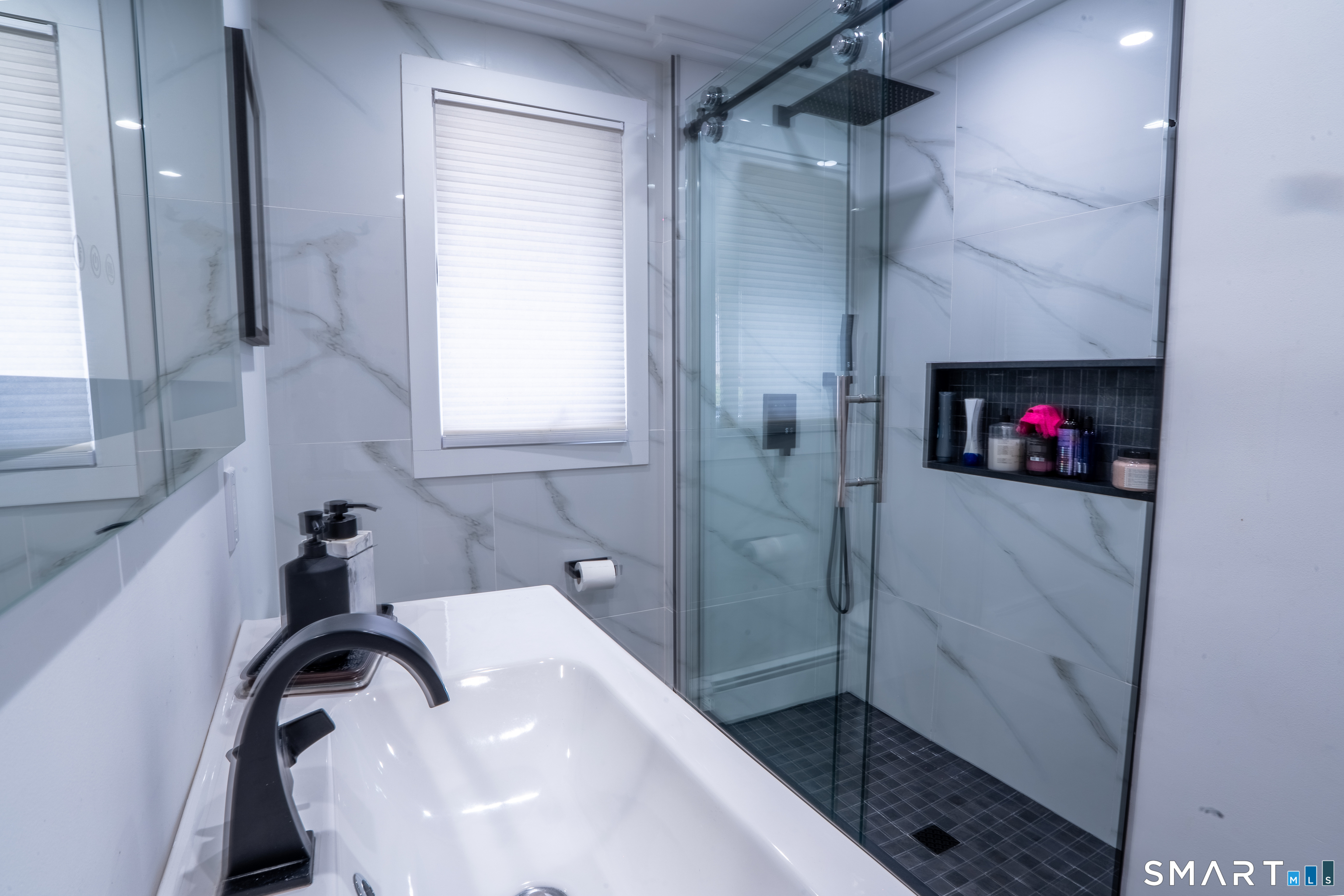 9 Cobblers Lane Norwalk, CT 06851 - Photo 19 of 29 a bathroom with a sink and a shower