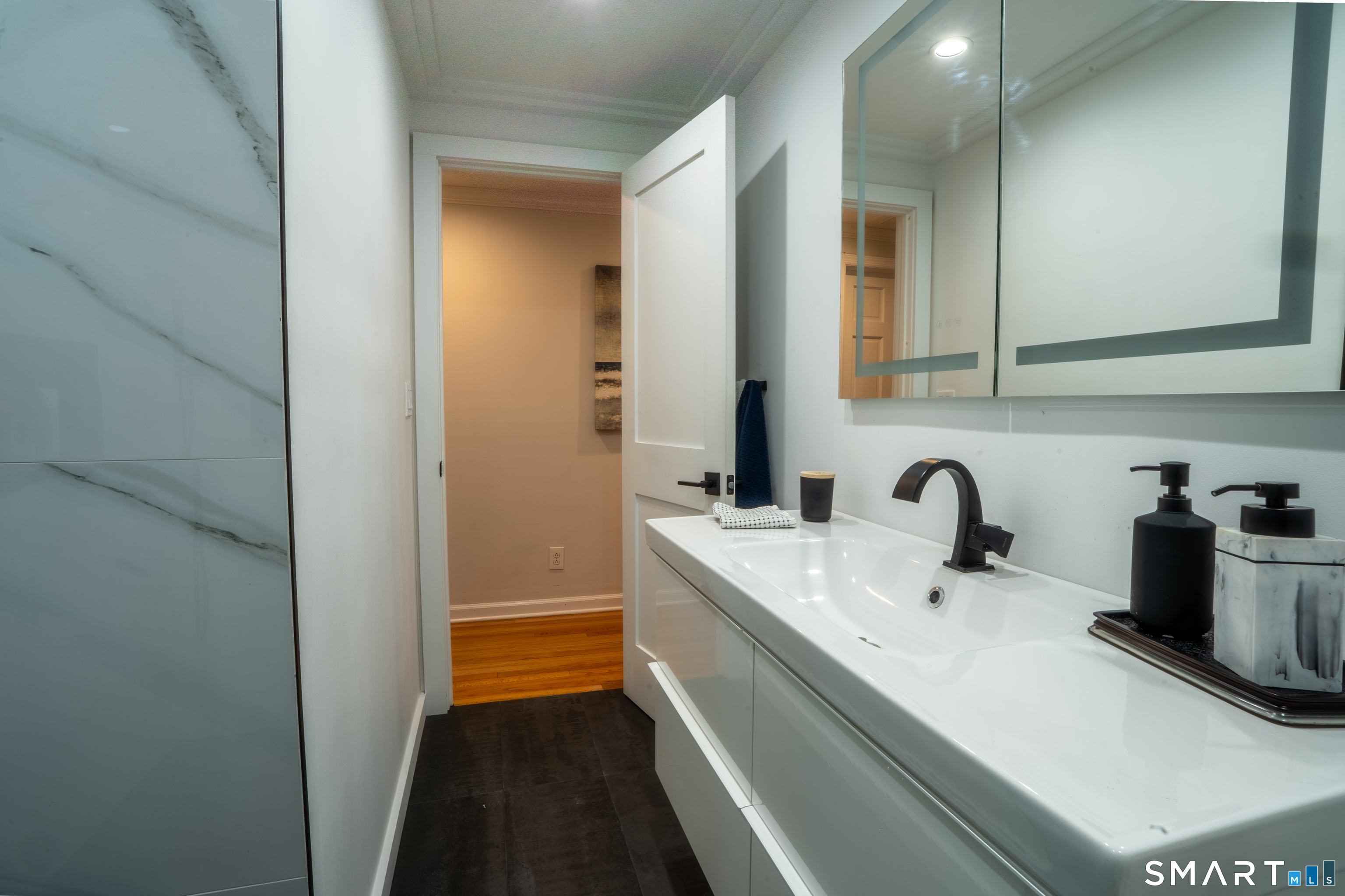 9 Cobblers Lane Norwalk, CT 06851 - Photo 20 of 29 a bathroom with a sink and a mirror