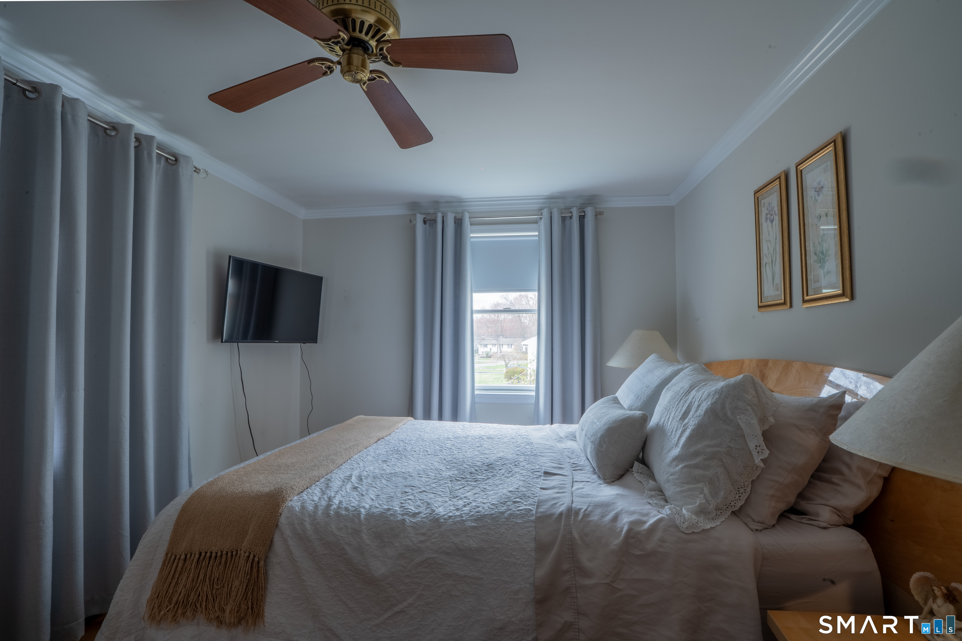9 Cobblers Lane Norwalk, CT 06851 - Photo 21 of 29 a bedroom with a bed and a television