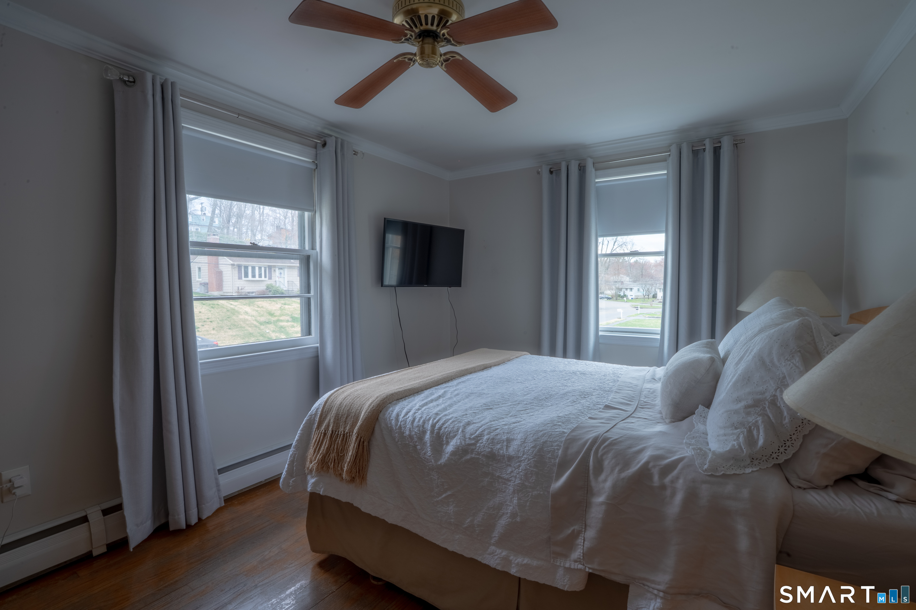 9 Cobblers Lane Norwalk, CT 06851 - Photo 22 of 29 a bedroom with a bed and wooden floor