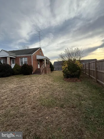 a view of house with yard and entertaining space