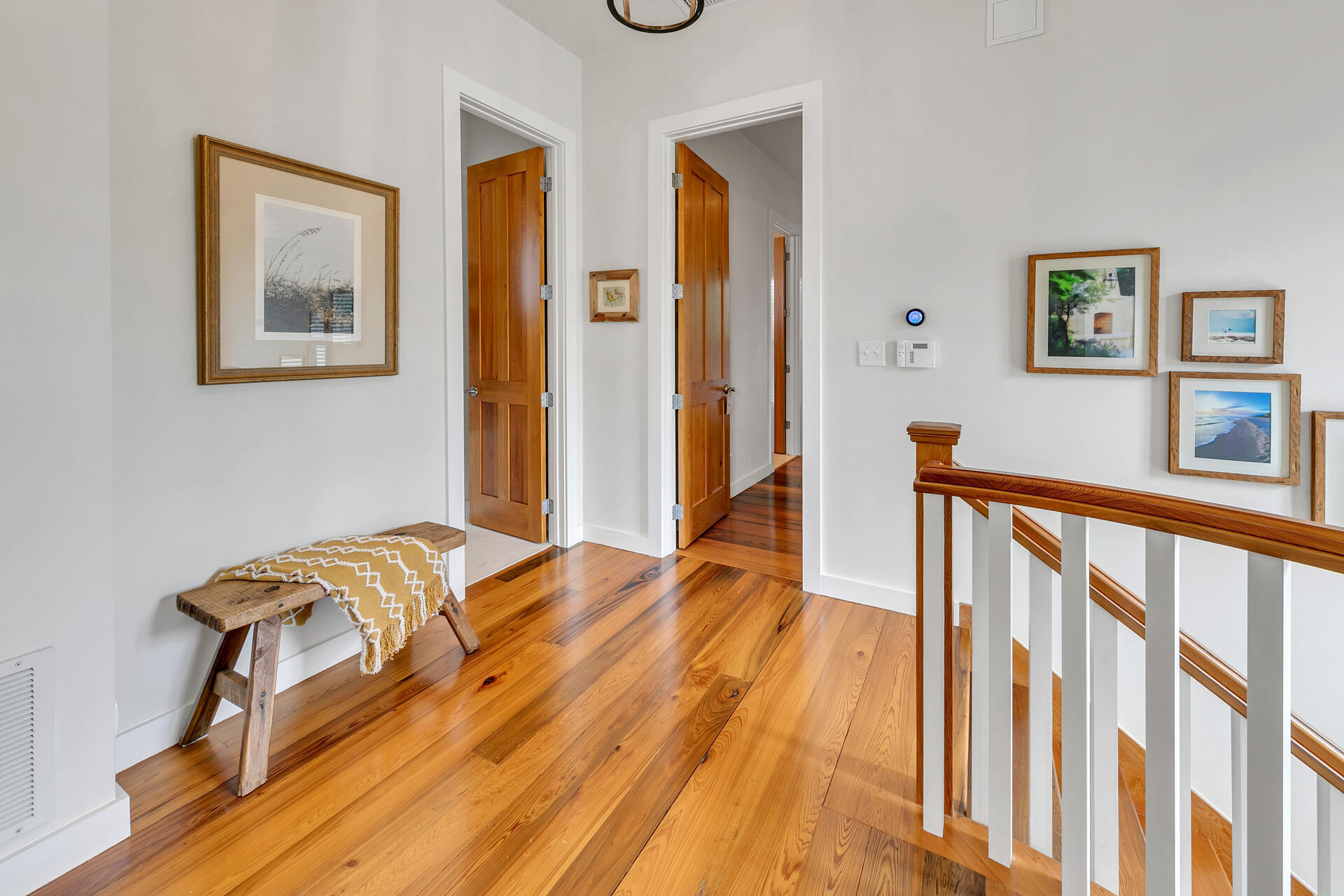 204 East Water Street Inlet Beach, FL 32461 - Photo 20 of 57 a view of a bedroom with wooden floor and bed
