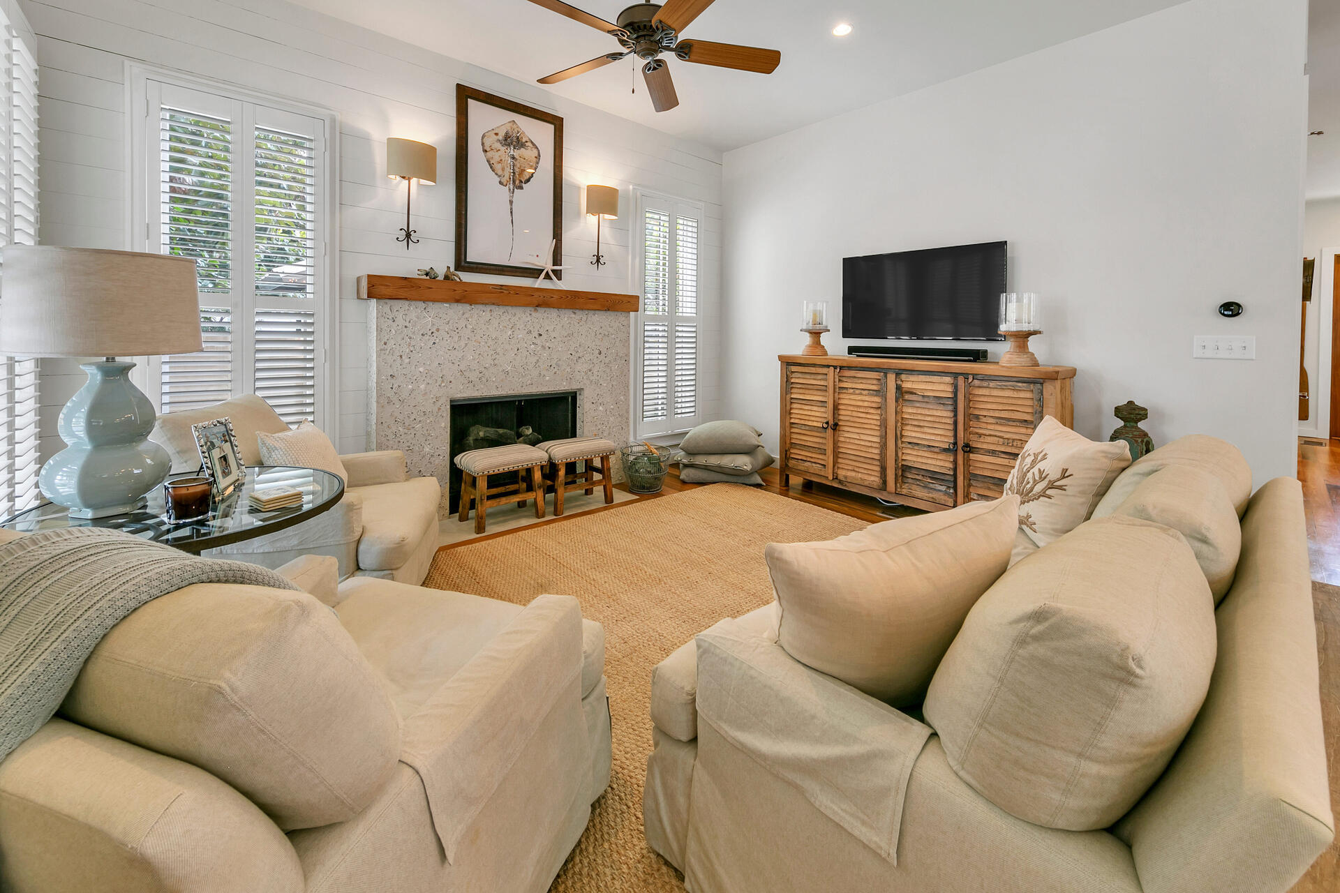 204 East Water Street Inlet Beach, FL 32461 - Photo 2 of 57 a living room with furniture a flat screen tv and a fireplace