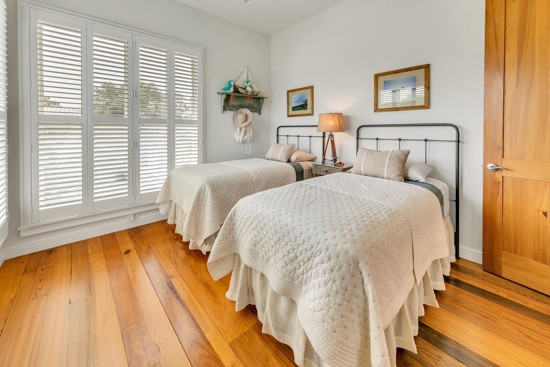 204 East Water Street Inlet Beach, FL 32461 - Photo 22 of 57 a bedroom with two beds and a large window