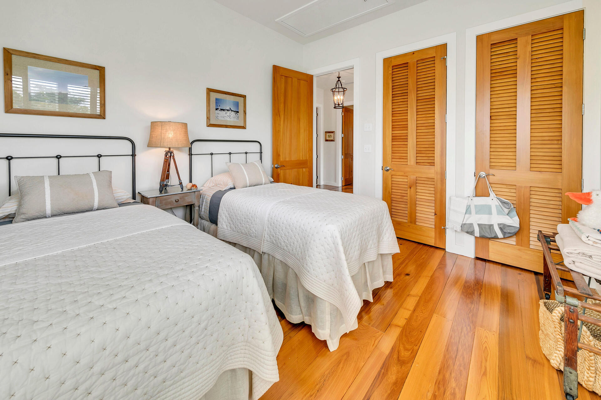 204 East Water Street Inlet Beach, FL 32461 - Photo 23 of 57 a spacious bedroom with two beds and a dresser next to a window