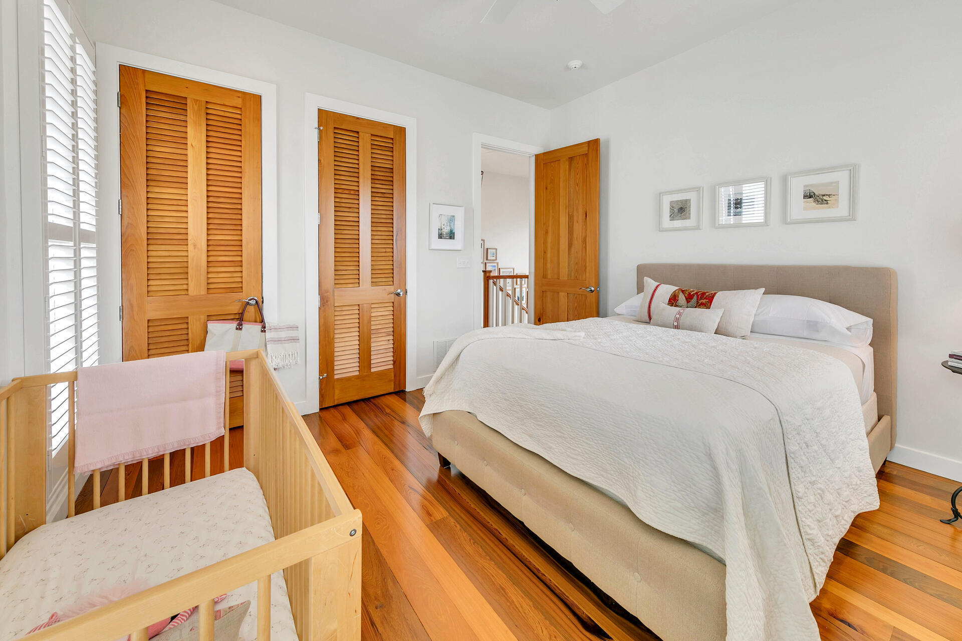 204 East Water Street Inlet Beach, FL 32461 - Photo 26 of 57 a bedroom with a bed and wooden floor