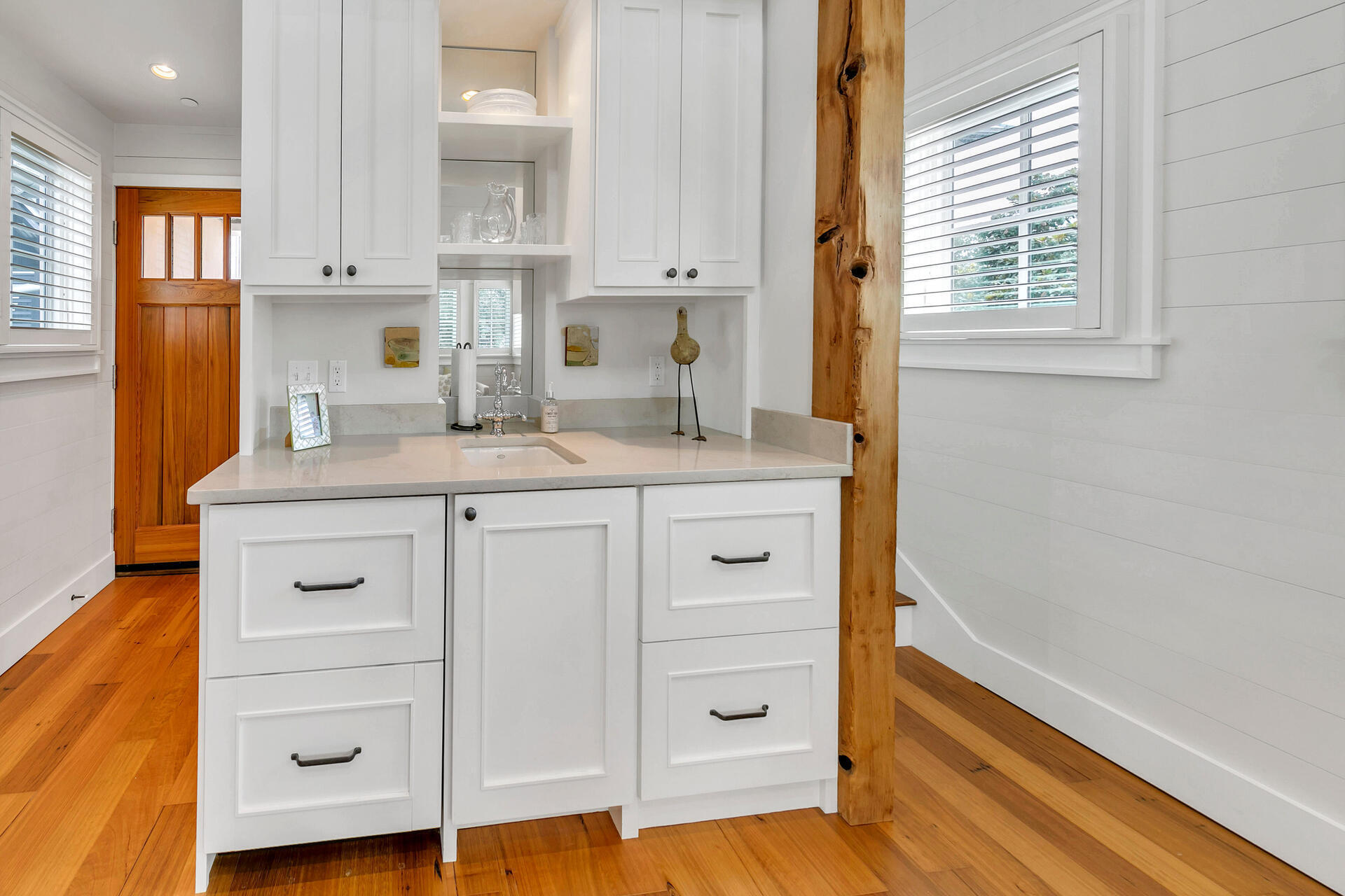 204 East Water Street Inlet Beach, FL 32461 - Photo 36 of 57 a kitchen with cabinets wooden floor and a window