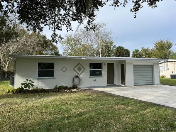 a house with trees in the background