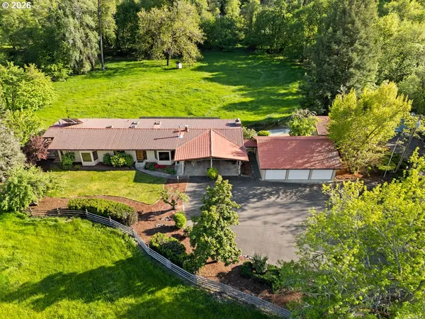 an aerial view of a house with a garden