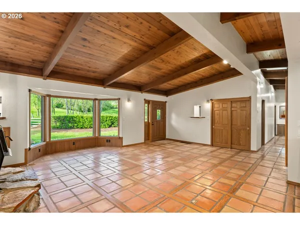 a view of a livingroom with wooden floor and yard