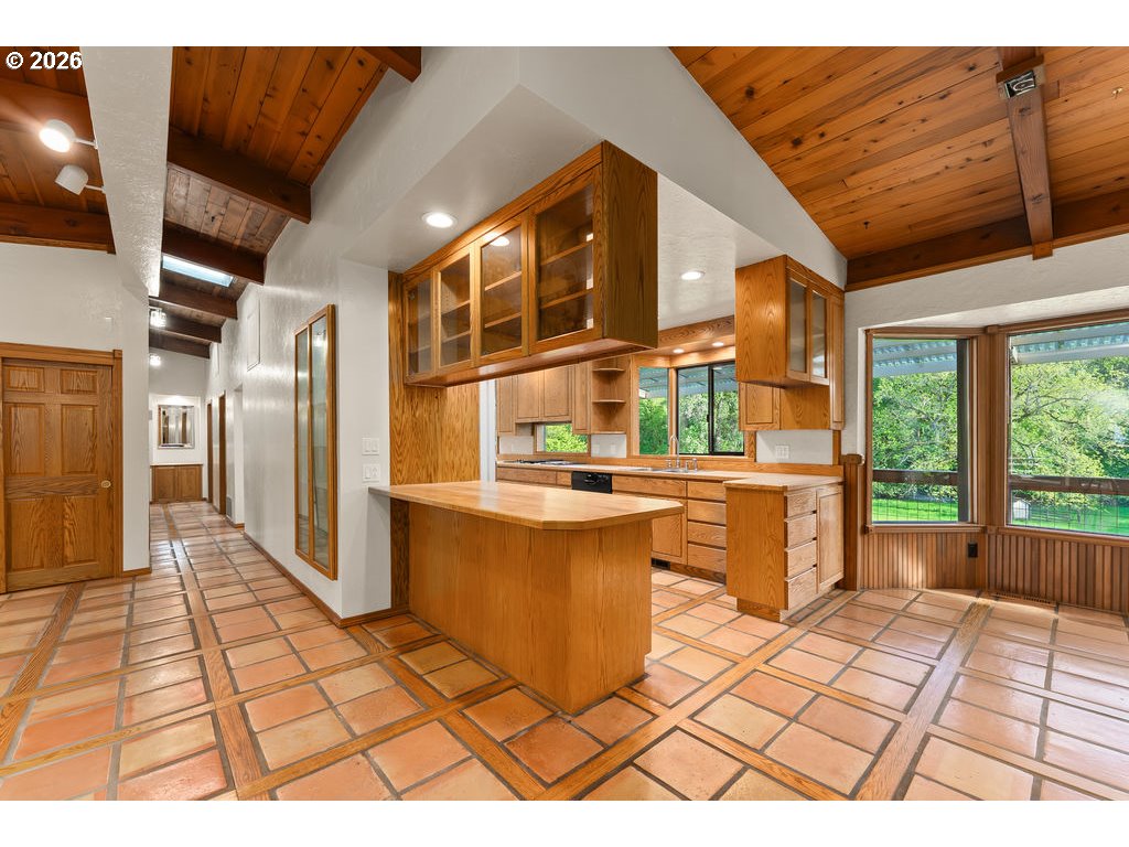 2233 East Riverside Drive Myrtle Creek, OR 97457 - Photo 16 of 47 a open kitchen with granite countertop a stove a sink and a cabinets