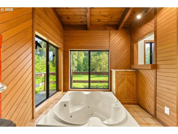 a bathroom with a shower and a sink