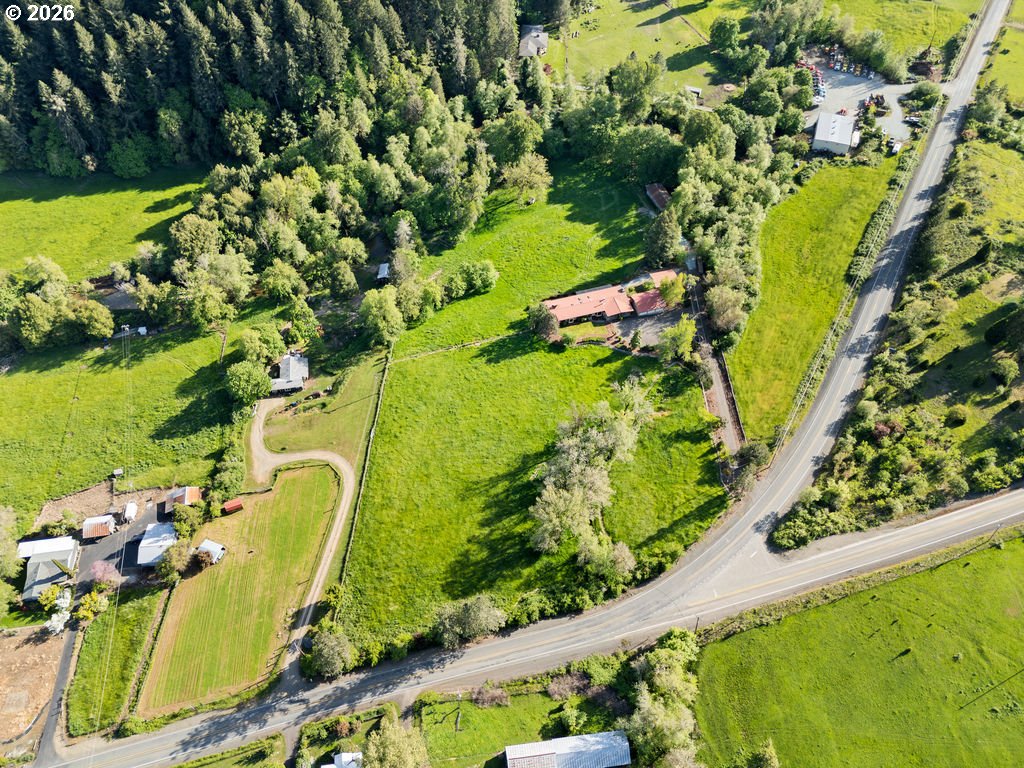 2233 East Riverside Drive Myrtle Creek, OR 97457 - Photo 46 of 47 a view of a swimming pool with a garden
