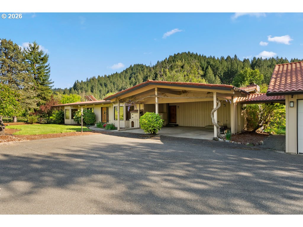 2233 East Riverside Drive Myrtle Creek, OR 97457 - Photo 6 of 47 a view of a house with a yard