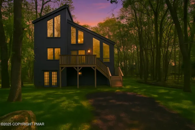 a view of a brick house with a yard