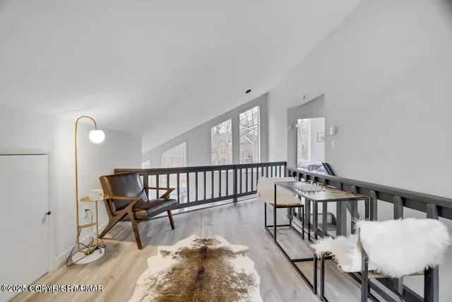 a view of a chairs and table in a bedroom